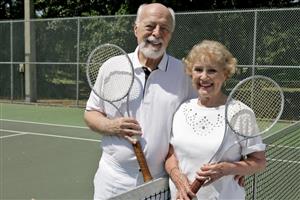 Senior Couple on Tennis Court