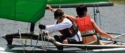 Kids sailing in a sail boat